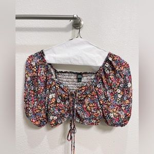 flowered crop top that has a bow that you can tie in the front!